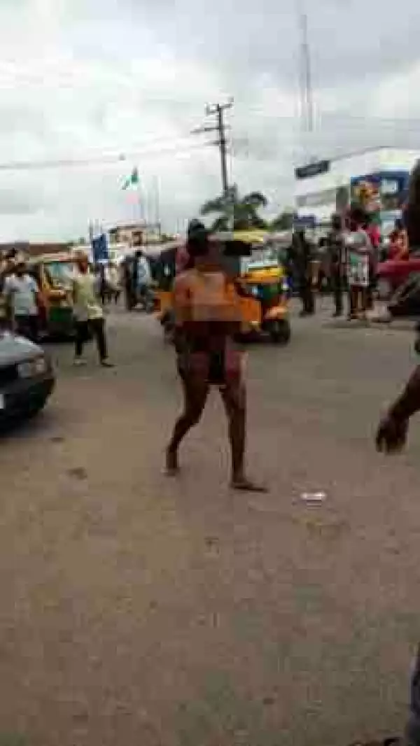 Prostitute Runs Mad Along Douglas Road In Owerri, Strips Herself Unclad (Photo)